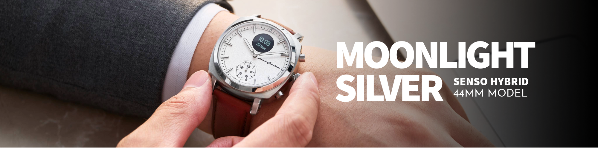 Watch with brown leather strap held by a hand, labeled 'Moonlight Silver Senso Hybrid 44mm Model'.